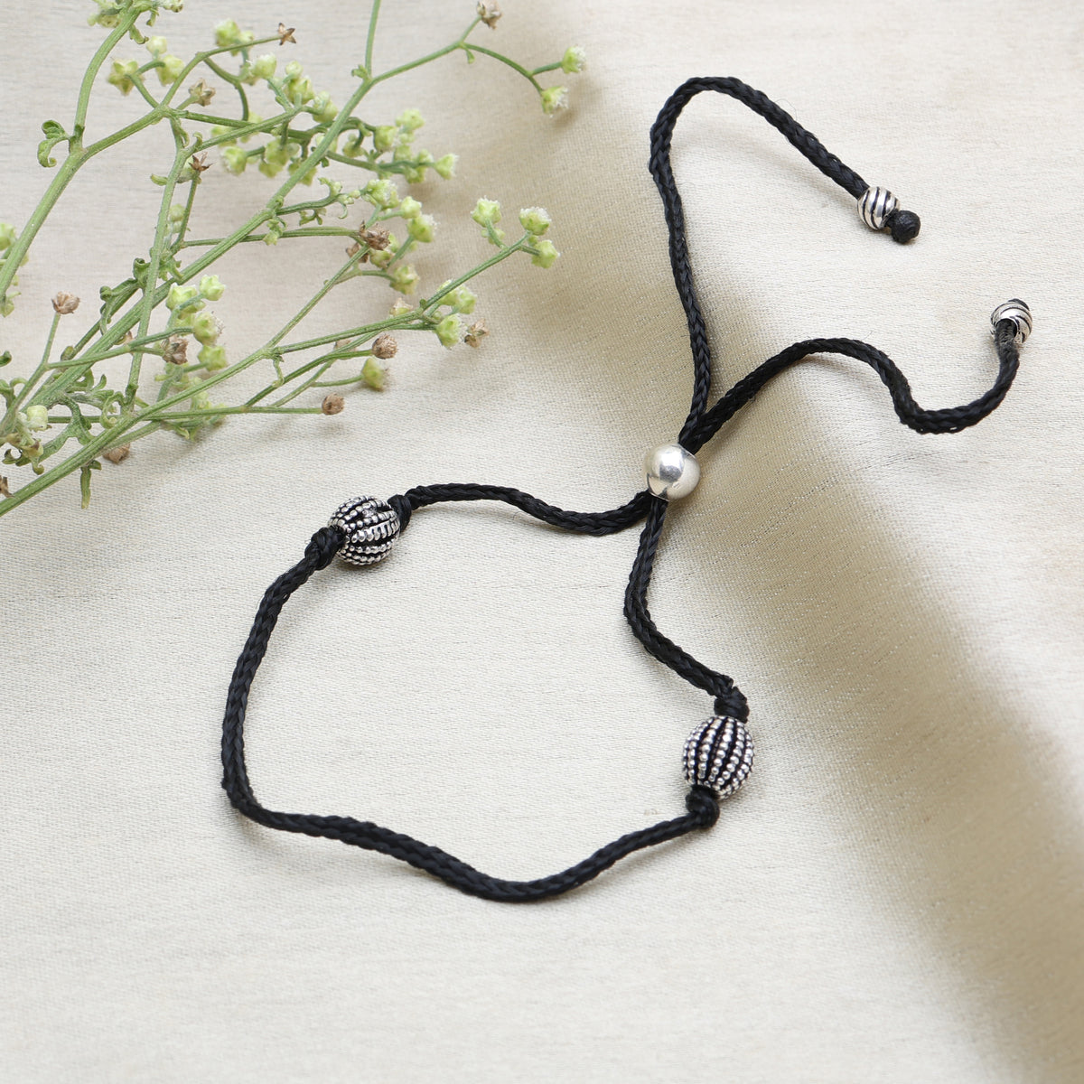 Black cord adjustable bracelet with oxidized silver beads