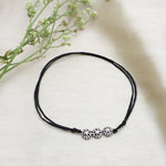 Load image into Gallery viewer, Black Cord Anklet with Three Floral Sterling Silver Charms
