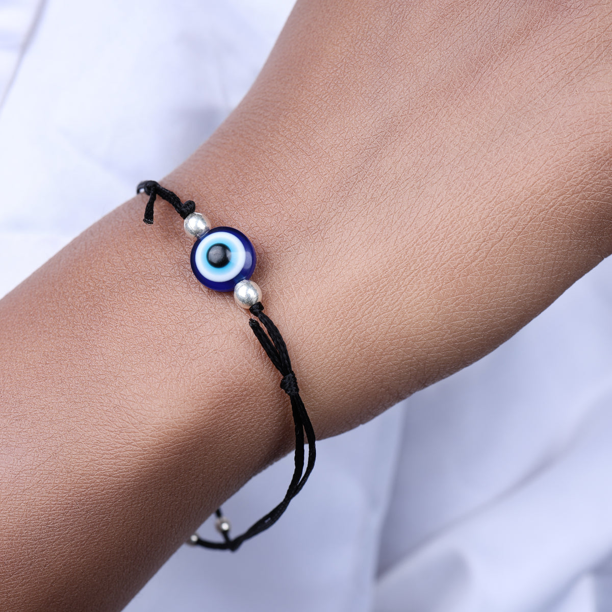 Adjustable black cord evil eye bracelet with silver beads for protection