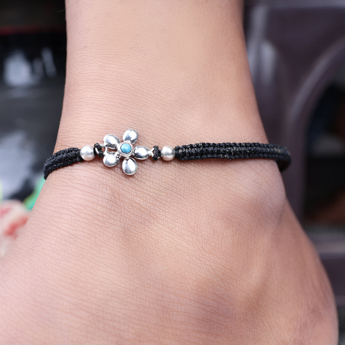 Black cord flower bracelet with turquoise bead, adjustable