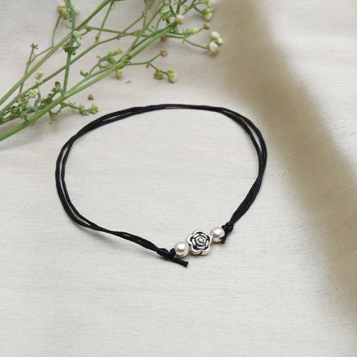 Adjustable black cord anklet with silver rose charm for women