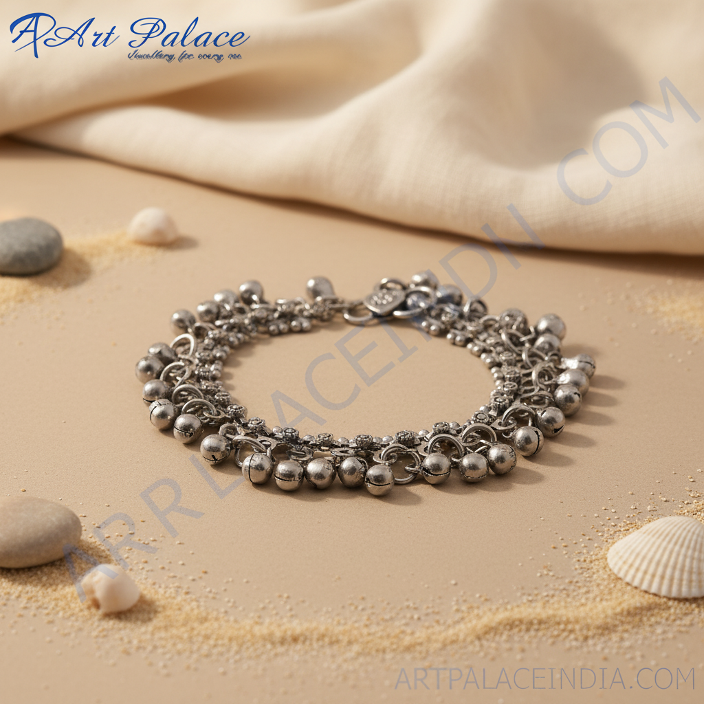 Silver bell anklet on a white background, perfect for adding a touch of elegance to any outfit.