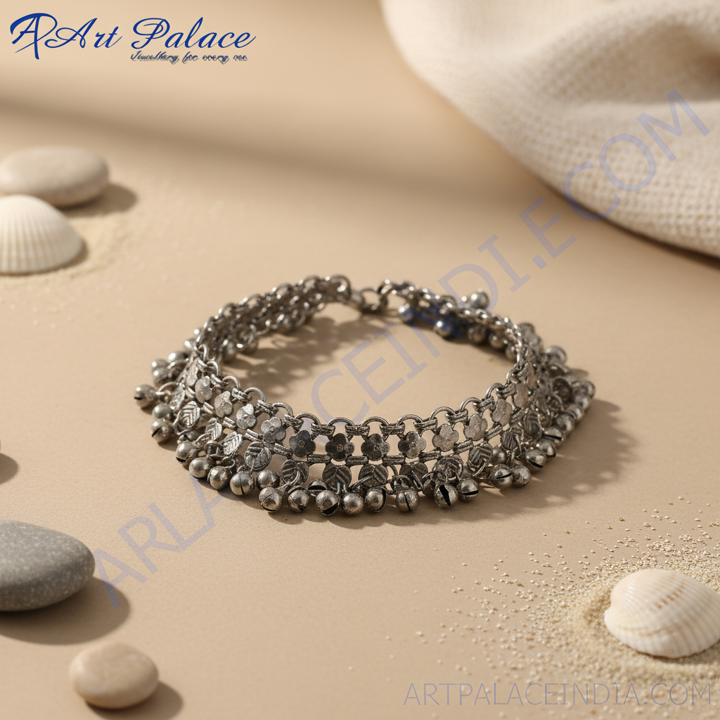 Silver anklet with dangling bells, perfect for adding a touch of bohemian style to your outfit.