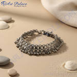 Load image into Gallery viewer, Silver anklet with dangling bells, perfect for adding a touch of bohemian style to your outfit.
