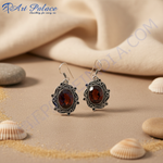 Load image into Gallery viewer, 925 sterling silver drop earrings with oval red garnet gemstones.
