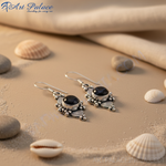 Load image into Gallery viewer, 925 sterling silver dangle earrings featuring a round black onyx gemstone set in an ornate design.
