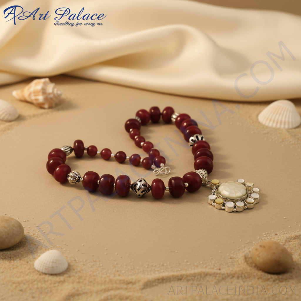 Red stone bead necklace with a silver pendant, perfect for adding a touch of elegance to any outfit.