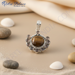 Load image into Gallery viewer, 925 sterling silver pendant with a central tiger eye gemstone and surrounding accent stones, a beautiful jewelry piece.
