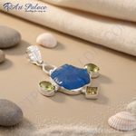 Load image into Gallery viewer, 925 sterling silver pendant with a large blue gemstone and smaller green and yellow stones.
