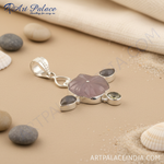Load image into Gallery viewer, 925 sterling silver flower pendant with a central pink gemstone and three accent stones, a beautiful piece of jewelry.
