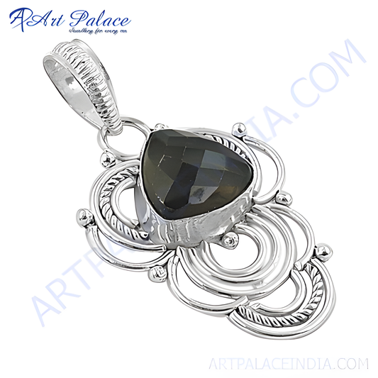 Sterling silver labradorite pendant with a teardrop-shaped gemstone in a detailed silver setting.