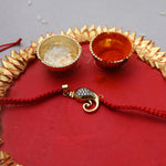Load image into Gallery viewer, Gold Plated 925 Silver Ganesha CZ Rakhi for Brother Raksha Bandhan
