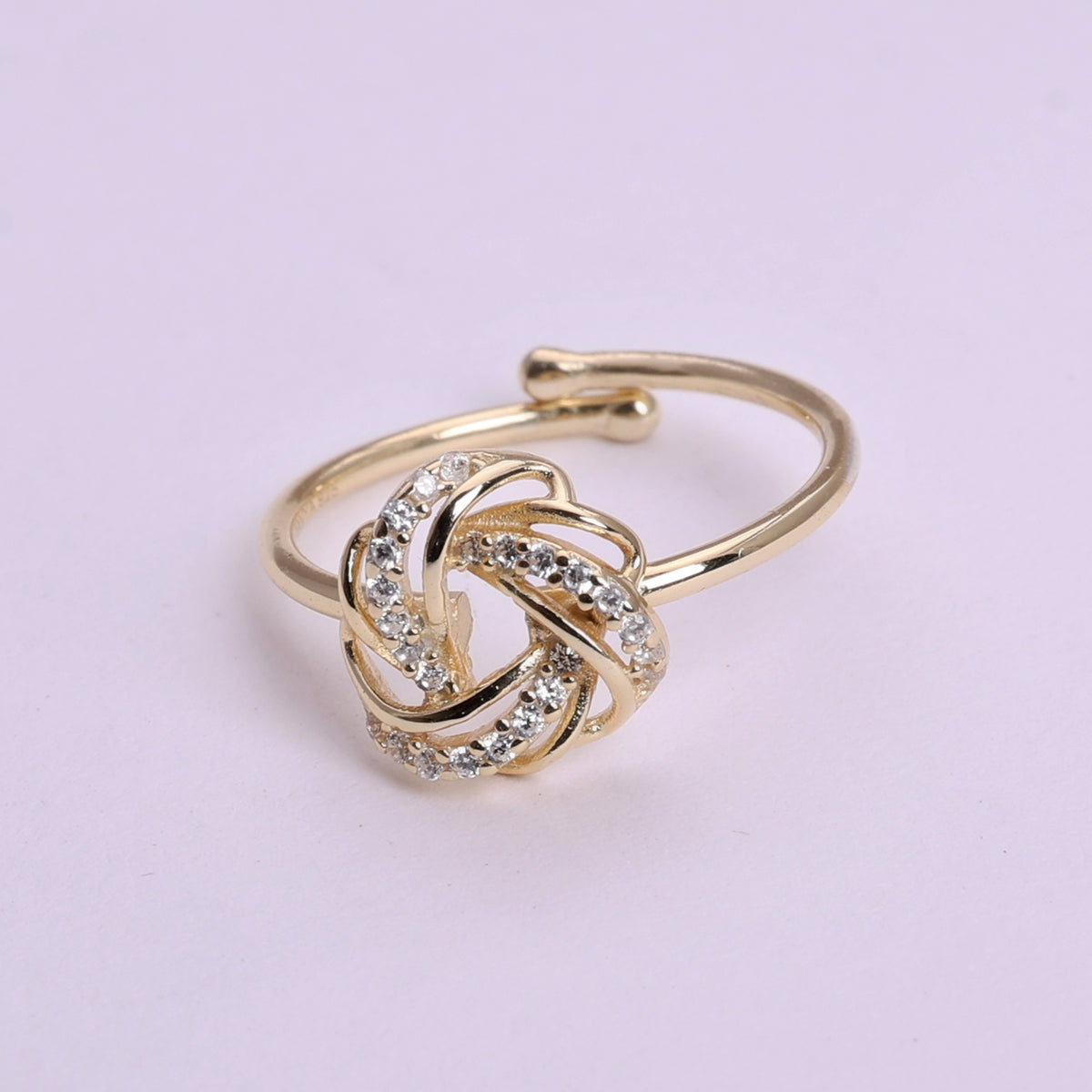 Gold plated adjustable knot ring with cubic zirconia stones